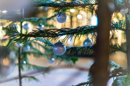 Background of Christmas tree with snow and bokeh.