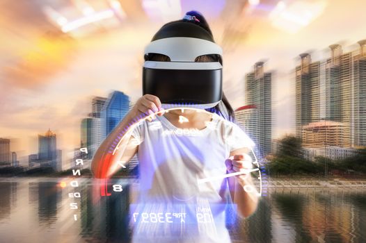 Concept of virtual reality, VR, device illustrated by kid wearing VR goggles headset playing car racing game.