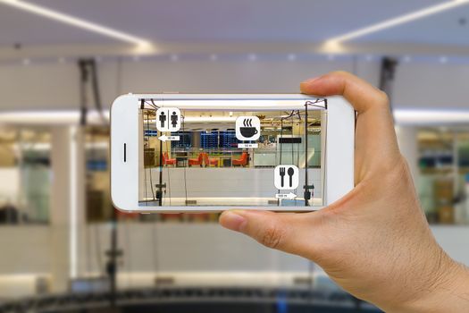 Augmented reality or AR for navigation concept application in mall looking for coffee shop, restaurant, and restroom.