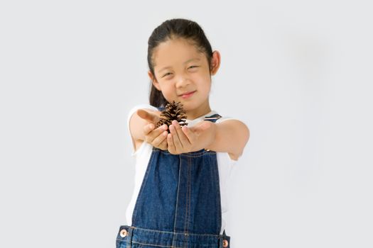 Studio shot of organic farming concept, Asian kid farmer, isolated on white background.