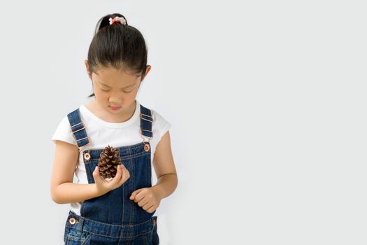 Studio shot of organic farming concept, Asian kid farmer, isolated on white background.