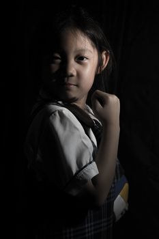 Portrait of determined Asian child for competition.