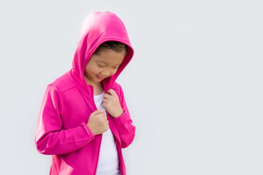 Studio Shot of Asian child in sweater isolated on white background.