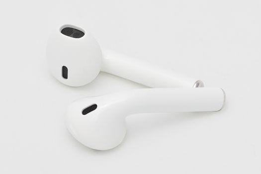Studio shot of wireless Bluetooth earphone or earbud  or headphone, isolated on white background.