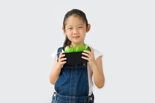 Studio shot of organic farming concept, Asian child farmer, isolated on white background.