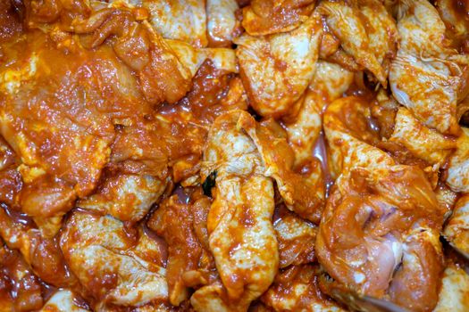 Spicy fermented fresh chicken meat in Korean style.