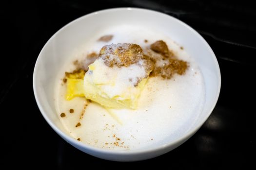 Bowl containing cookie ingredients, flour, butter, and sugar.