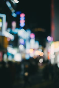 Bokeh or defocused of night life in city.