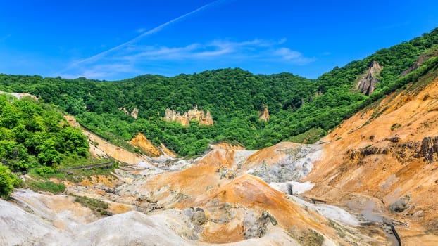 Scene of mountain and blue sky in Hokkaido, Japan.