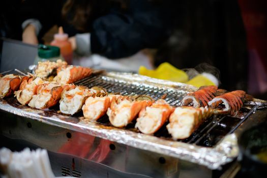 Freshly grilled lobster in street food style.