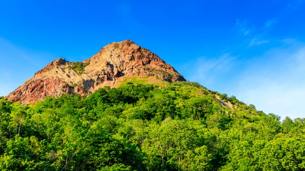 Scene of mountain and blue sky in Hokkaido, Japan.