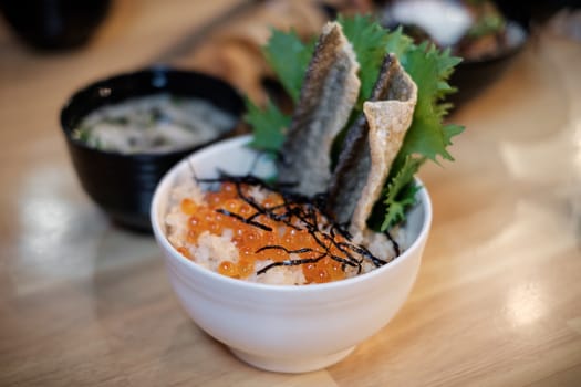 Japanese rice bowl with salmon eggs, caviar topping.
