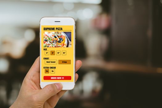 Concept of fast food, pizza, ordering illustrated by smartphone app in online mobility era.