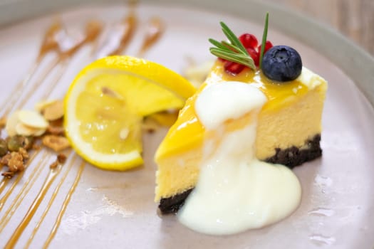 Lemon cheese cake with yogurt sauce on top.
