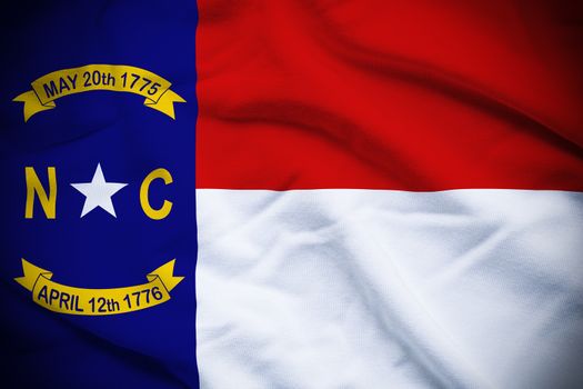 Wavy and rippled national flag of North Carolina background.