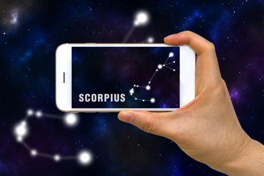 Concept of augmented reality, AR, of Scorpius zodiac constellation app on smartphone.