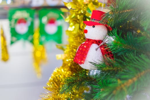 Snowman on a Christmas tree as decoration.