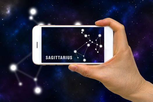 Concept of augmented reality, AR, of Sagittarius zodiac constellation app on smartphone.