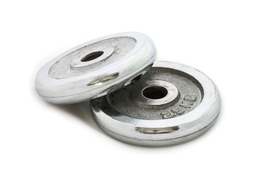 Stack of iron plates for weight training isolated on white background.