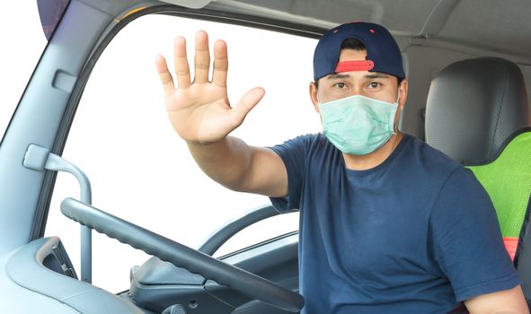 Close-up photos of Asian truck drivers wearing masks to protect against dust and the spread of the flu. Covid 19. Inside the car front