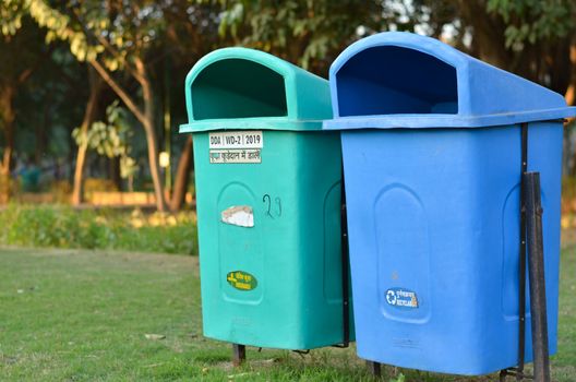 New Delhi government has installed a lot of green & blue dustbins throughout the city, this one in a park. The green ones for organic waste, & blue for non organic, non recyclable waste