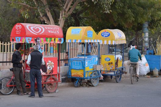 New Delhi, India, 2020. Cream bell, Mother dairy and Walls Ice cream stalls near India gate. A central spot for tourists and locals, most people go out to eat ice cream in the evening at these stalls.