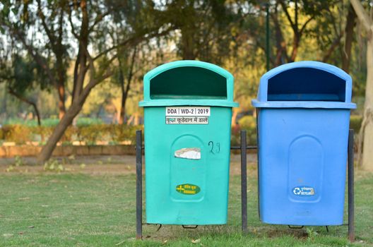 New Delhi government has installed a lot of green & blue dustbins throughout the city, this one in a park. The green ones for organic waste, & blue for non organic, non recyclable waste