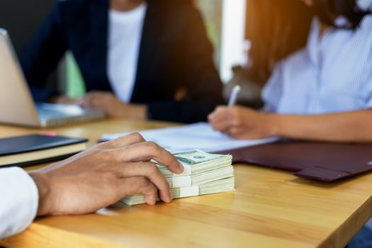 Business woman signing a loan for investment, negotiation