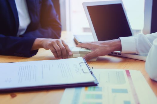 Business woman signing a loan for investment, negotiation