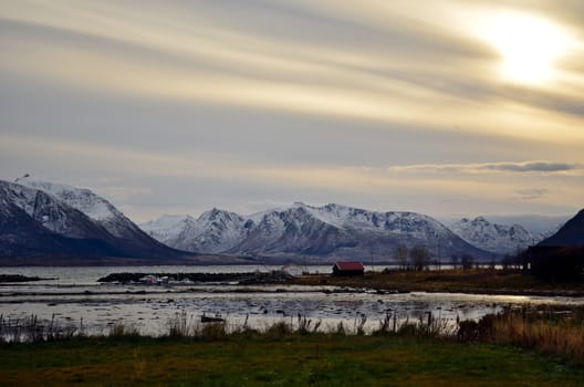 The house on the coast of the silent bay in Northern Norway