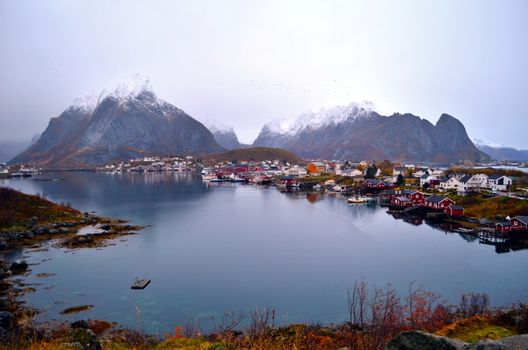 Marvelous and calm harbor during a foggy day in Northern Norway