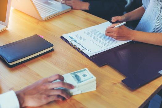 Business woman signing a loan for investment, negotiation