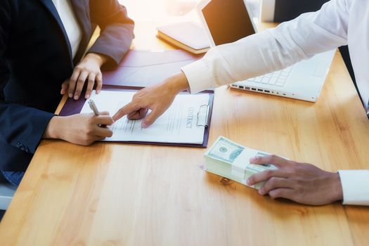 Business woman signing a loan for investment, negotiation