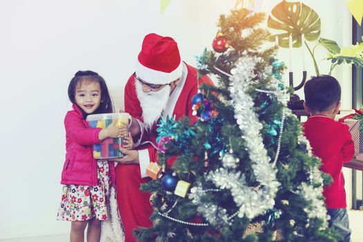 Father and son help to decorate the Christmas tree.