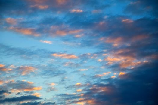 Blue sky with white clouds And the light of the sunset.