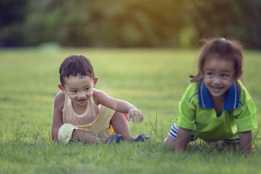 Happy family playing in the park. Mother and son play together in nature in the summer