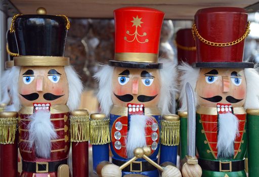 Three colorful wooden christmas nutcrackers on display