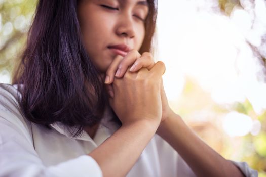 The woman prayed for the morning glow.