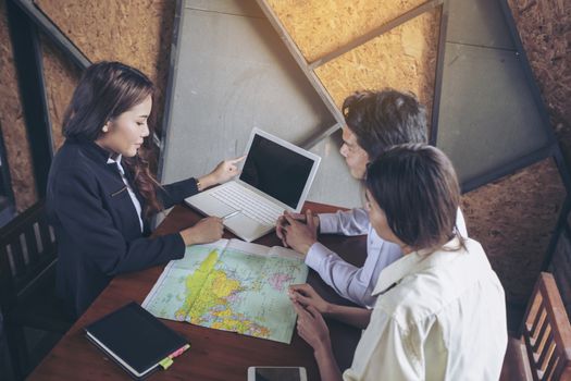 Businesspeople and partners shaking hands over the table, maintaining eye contact, confident entrepreneurs ready for effective negotiations, entering into a partnership, gender equality