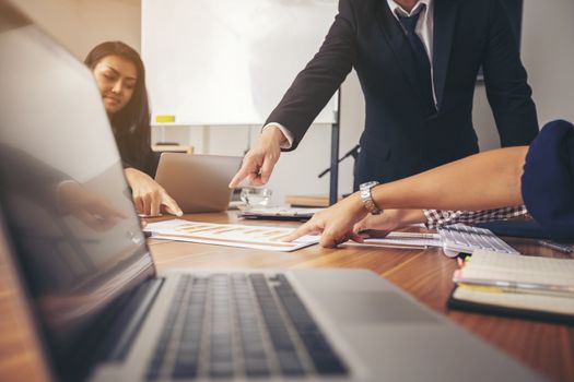 Business leader presenting new project. Businessman standing and leading business presentation. Male executive putting her ideas during presentation in conference room. 