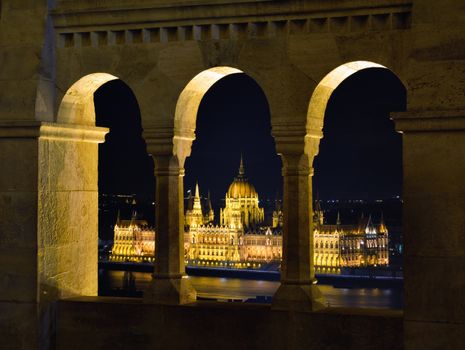 Hungarian Parliament through Fishermans bastion arcades, Budapest.