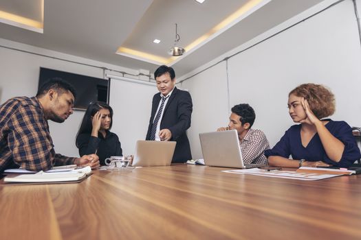 Business leader presenting new project. Businessman standing and leading business presentation. Male executive putting her ideas during presentation in conference room. 