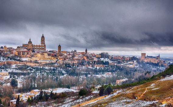 The city of Segovia in Spain snowed in winter.