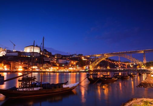 Porto, old town skyline with the Douro river and rabelo boats. Is the second largest city in Portugal after Lisbon and famous by Porto wine.