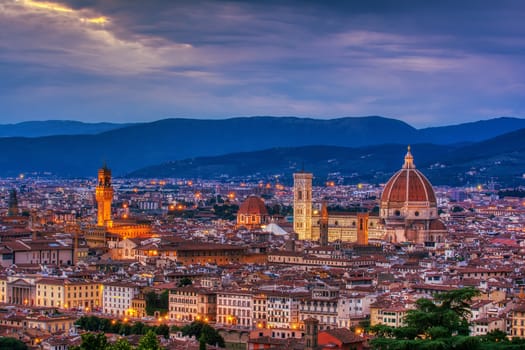 Duomo Santa Maria Del Fiore and tower of Palazzo Vecchio at sunset in Florence, Tuscany, Italy