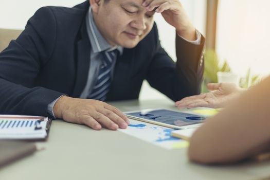 Businessmen are working hard and being pressured by their colleagues to complete their work. business, overwork, people, deadline concept 