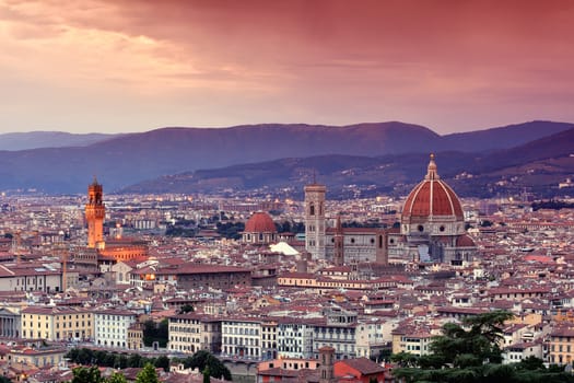 Duomo Santa Maria Del Fiore and tower of Palazzo Vecchio at sunset in Florence, Tuscany, Italy