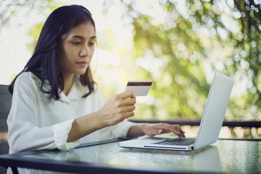 Young woman with credit card payment from shopping online