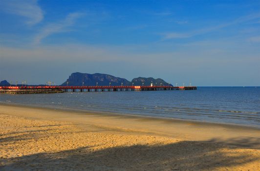 Red bridge that extends to the sea, Saran Withi Bridge Is an important tourist destination of Prachuap Khiri Khan Province, Thailand.