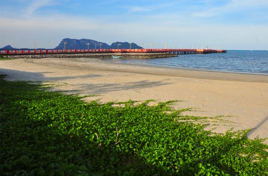 Red bridge that extends to the sea, Saran Withi Bridge Is an important tourist destination of Prachuap Khiri Khan Province, Thailand.